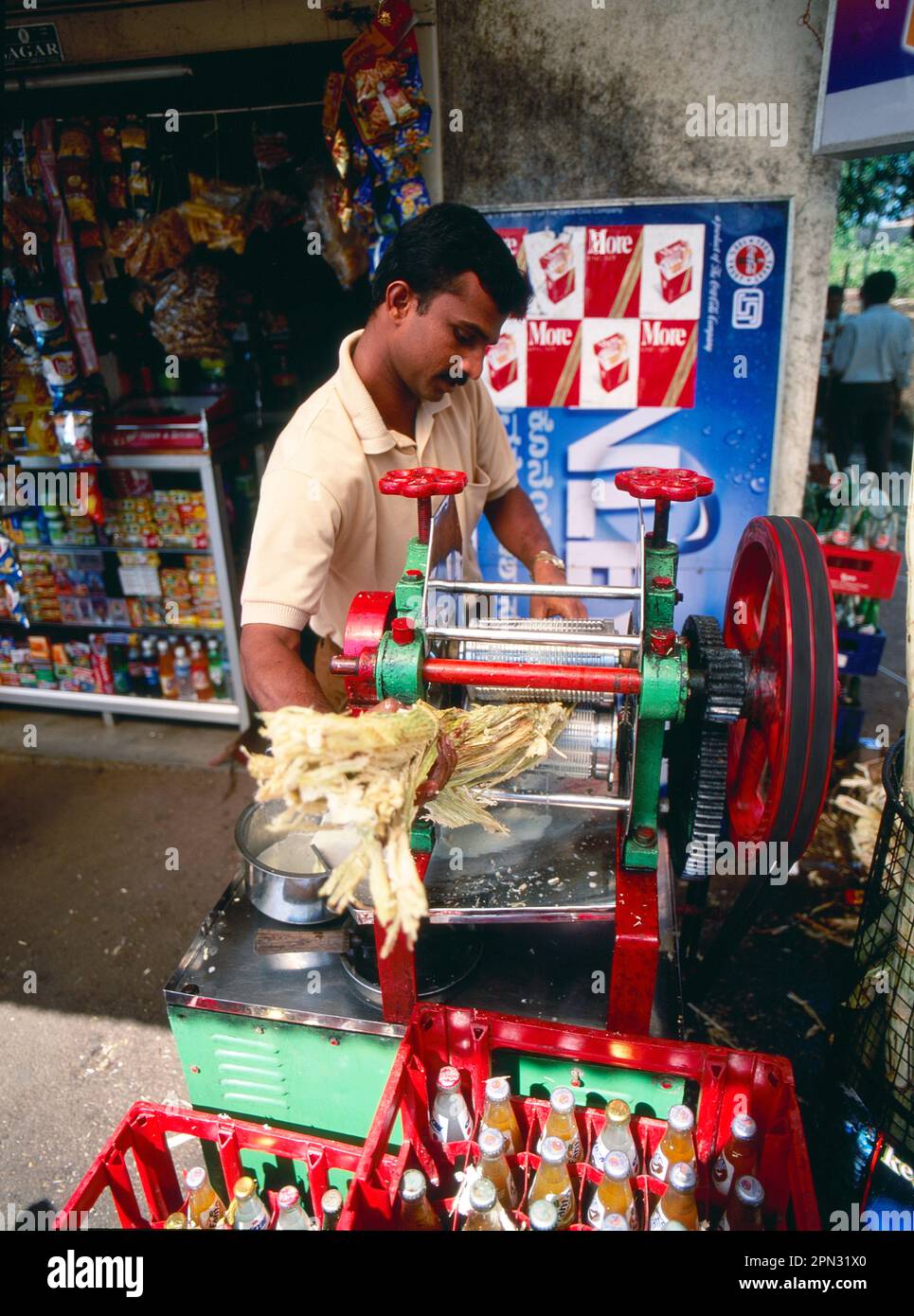 A sugarcane juice pressing machine in Goa, India Stock Photo