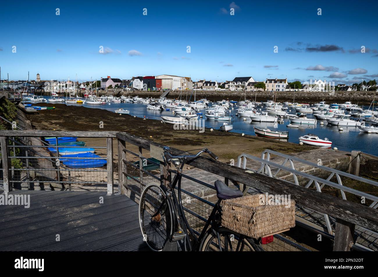 Old Bicyle With Basket At The Harbor Of Finistere City Guilvinec At The Coast Of Atlantic In Brittany, France Stock Photo