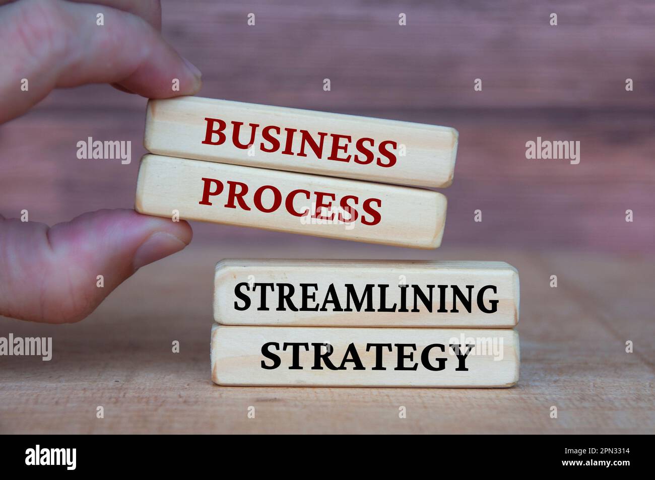 Business process and streamlining strategy text on wooden blocks