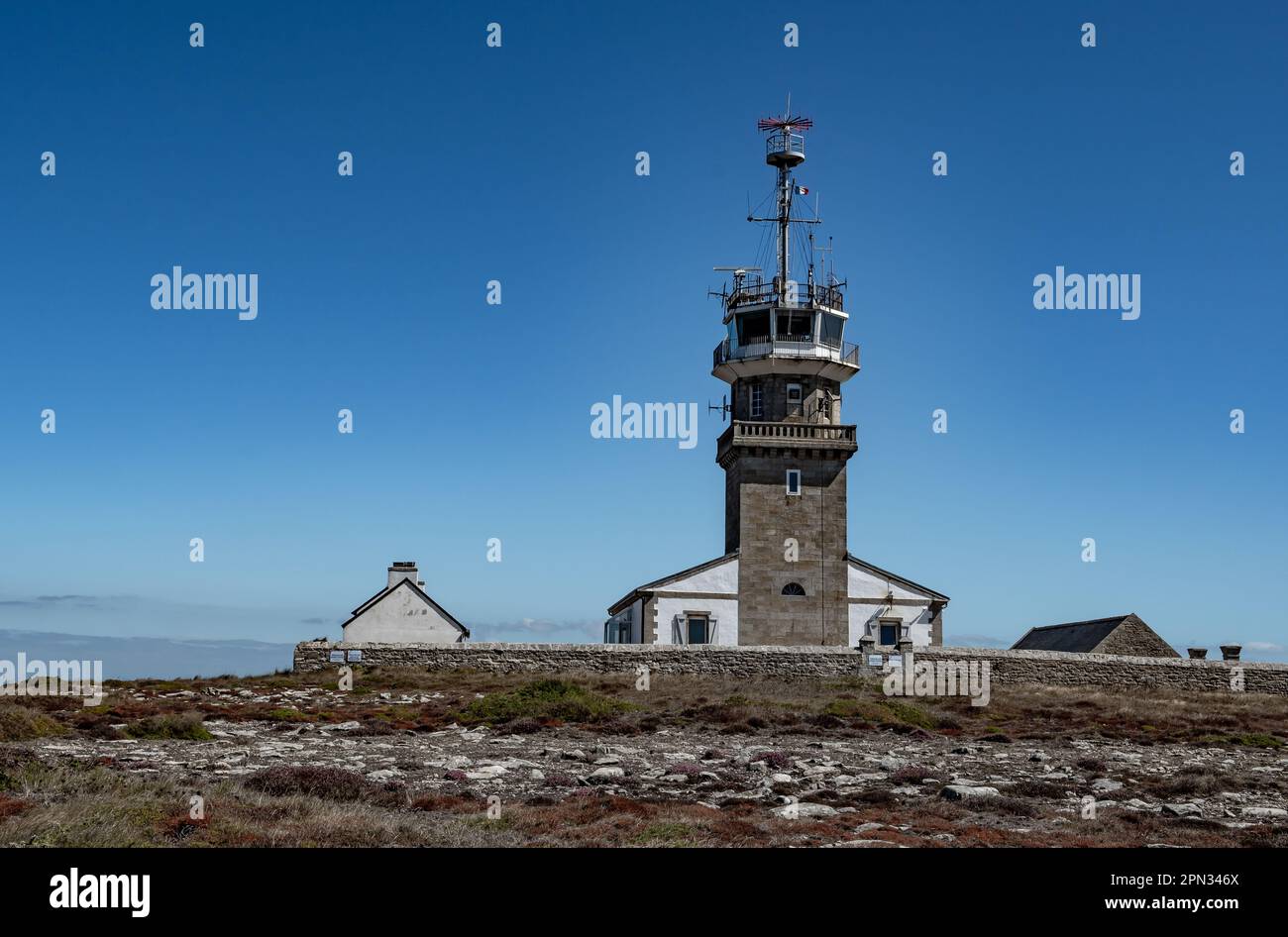 Lighthouse At Peninsula Pointe Du Raz At The Finistere Atlantic Coast In Brittany, France Stock Photo