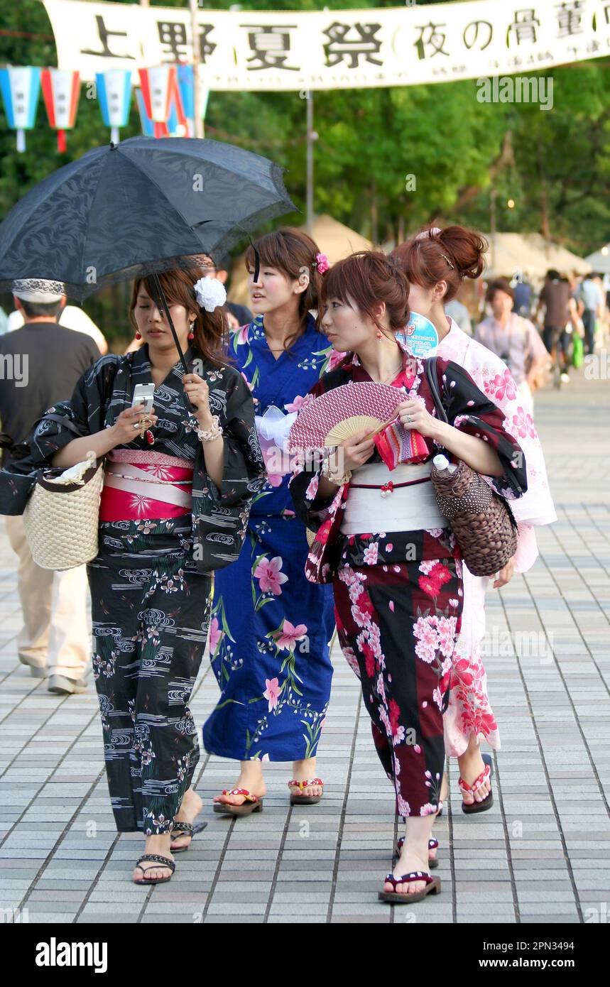 TOKYO, JAPAN-JULY 19:Unidentified Girls in Kimono waking at Ueno Park in a Hot Summer Day. July 19,2008 in Tokyo, Japan Stock Photo