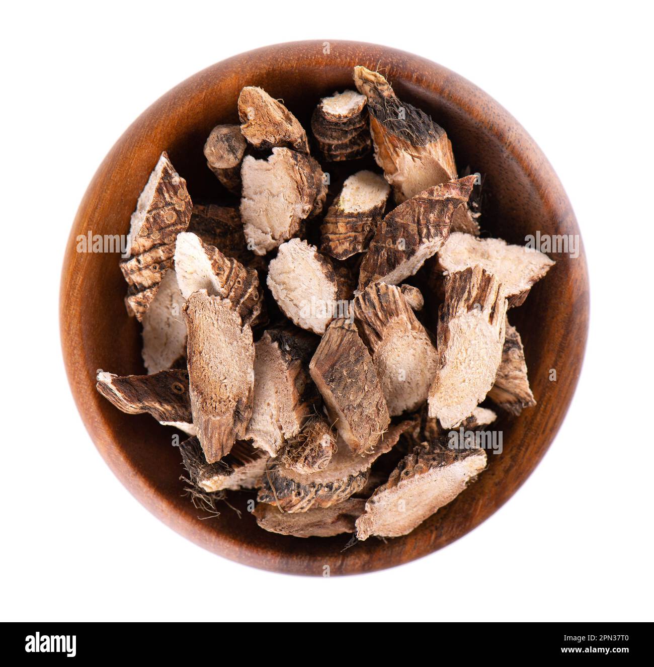 Calamus root in wooden bowl, isolated on white background. Sweet flag