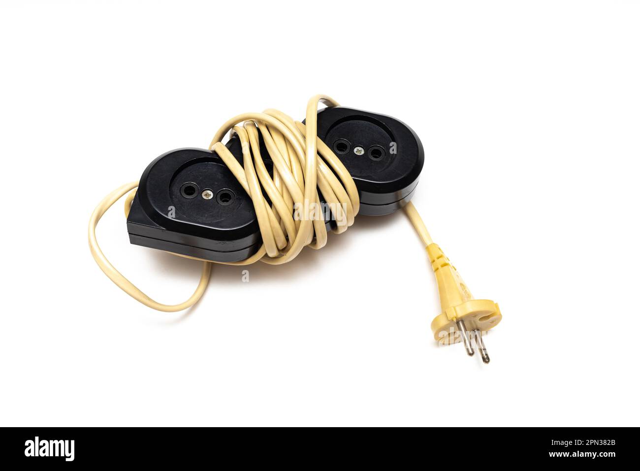 old electrical extension cord isolated on white background. old