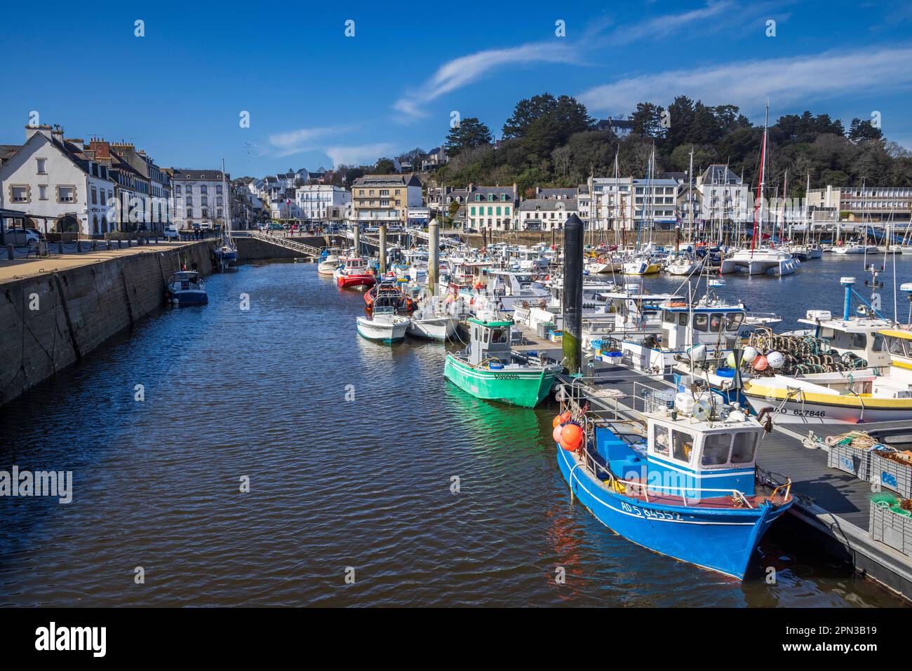 Moored Fishing boats in the harbour at Audierne on the Goyen river, Brittany, France Stock Photo