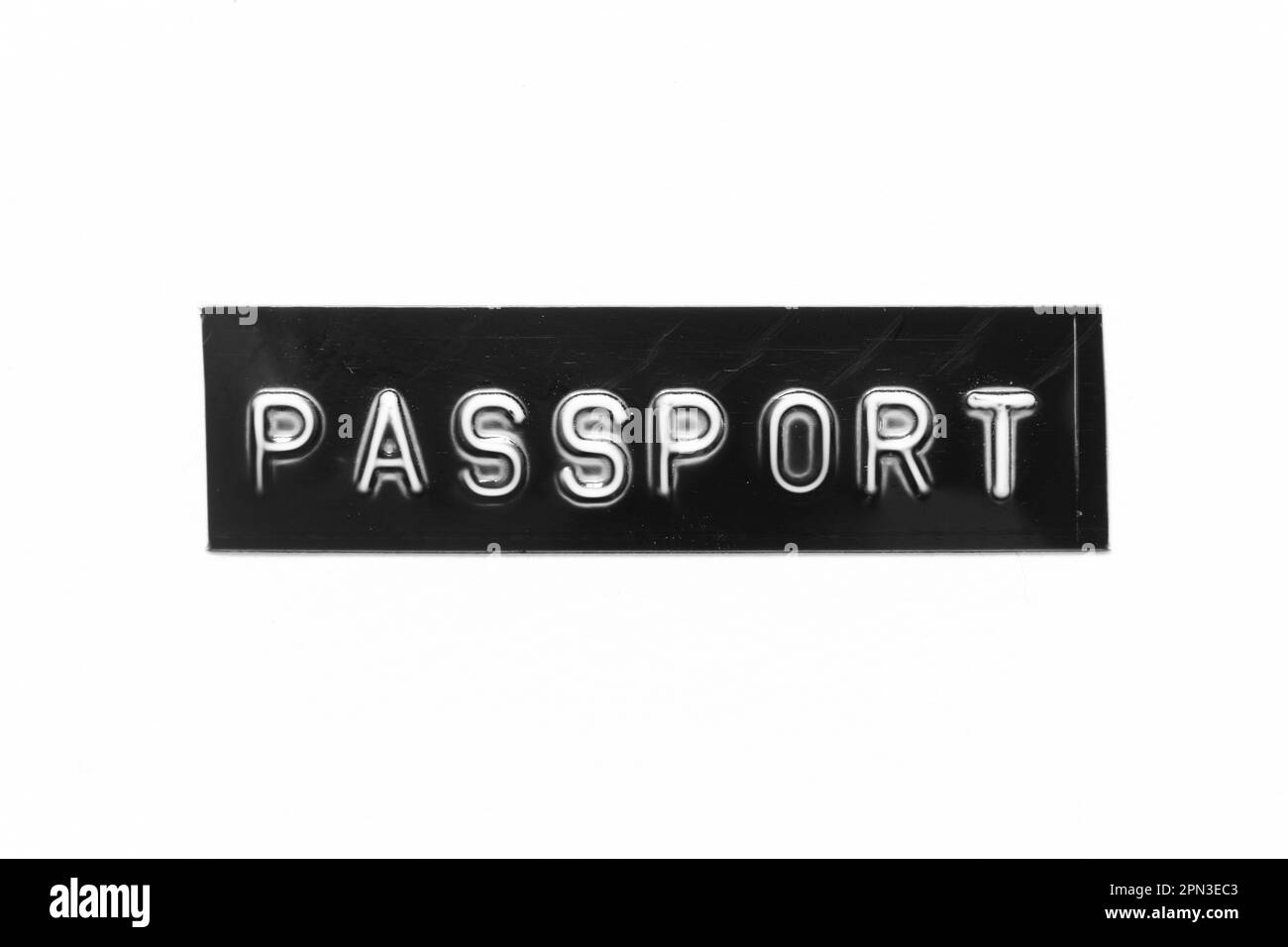 Black color banner that have embossed letter with word passport on white paper background Stock Photo