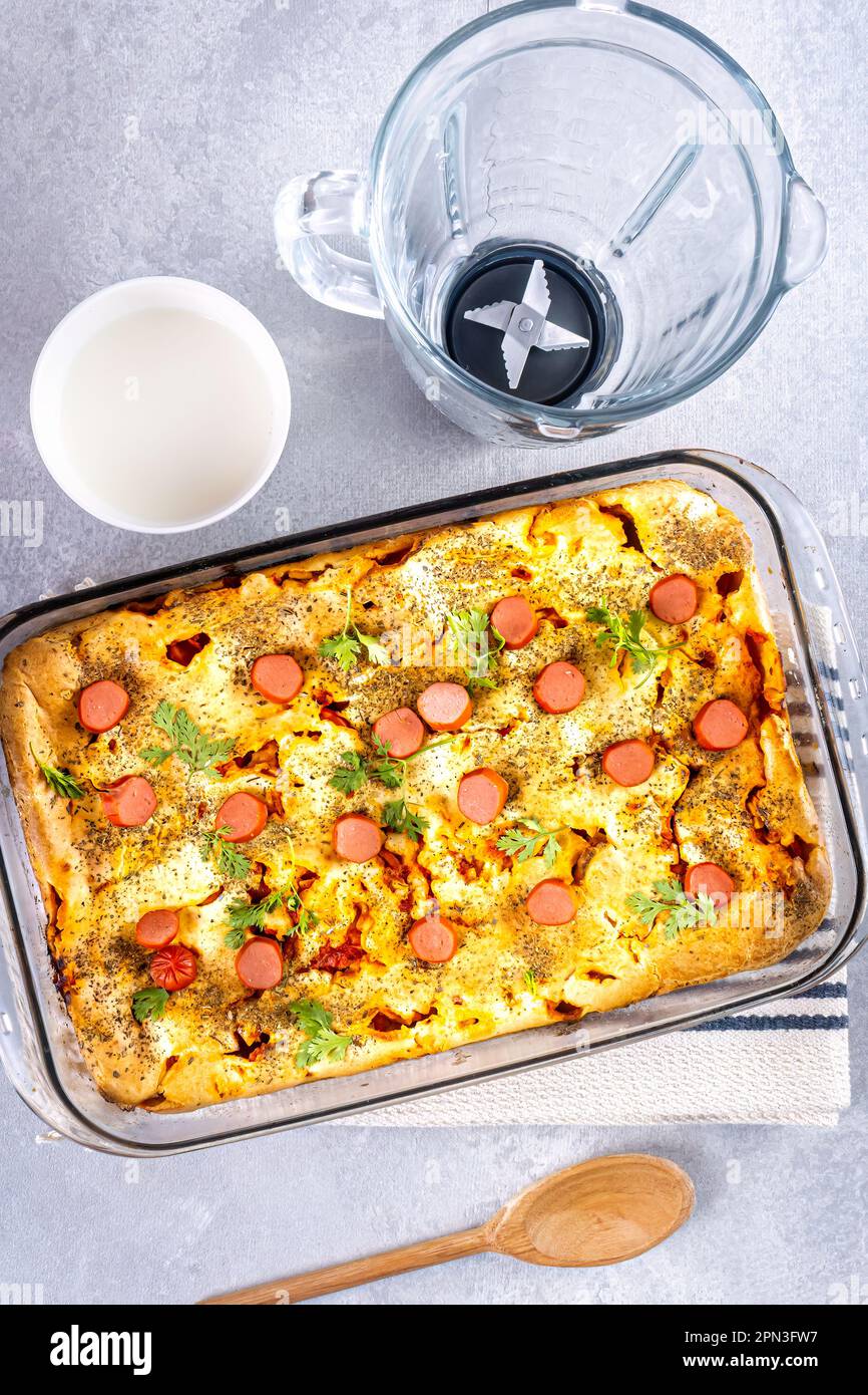 Sausage pie in a blender, typical Brazilian dish. Ingredients milk