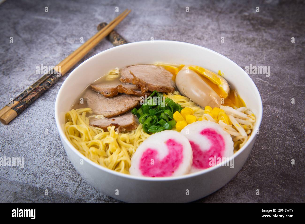 Fresh ramen noodles with garnish, pork tenderloin, eggs marinated in
