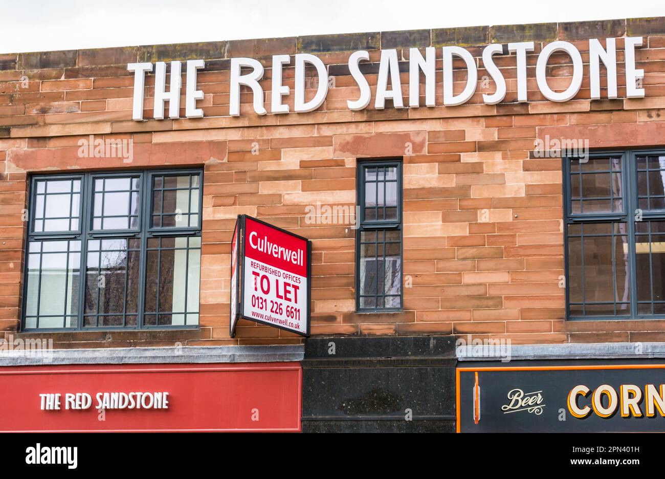 Newly restored 1930s Art Deco style The Red Sandstone building on Leith Walk with offices to let advertising sign, Edinburgh, Scotland, UK Stock Photo