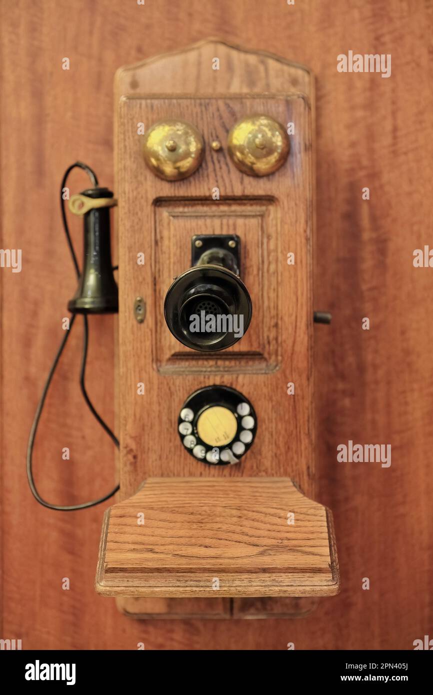 591 Vintage wall mounted wood telephone of the fiddleback cathedral