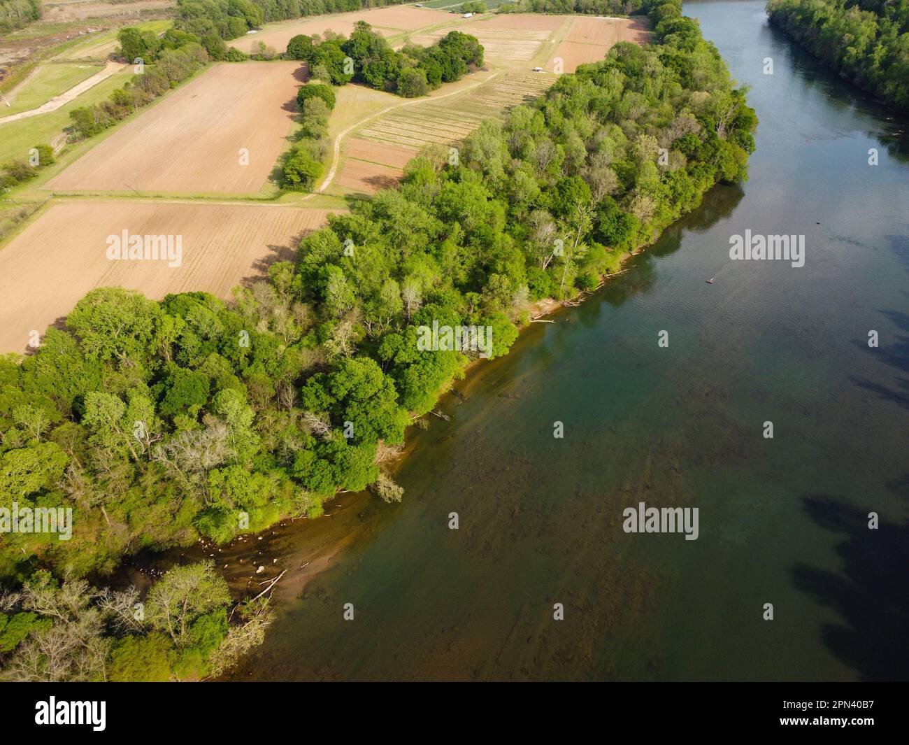 Agricultural fields ready to be planted next to calm Catawba River ...