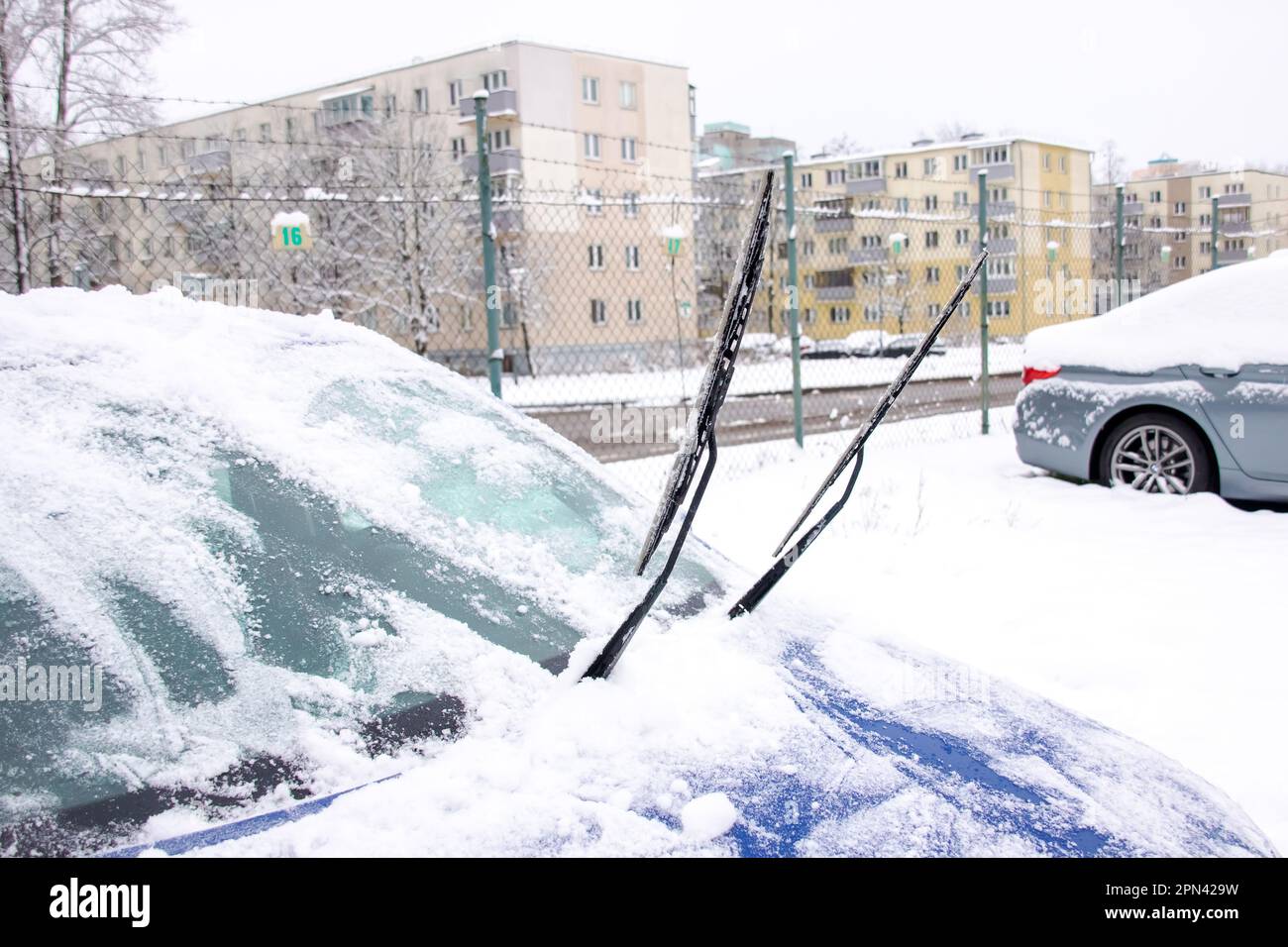 Snow on the hood and windshield of the car close up stock photo alamy