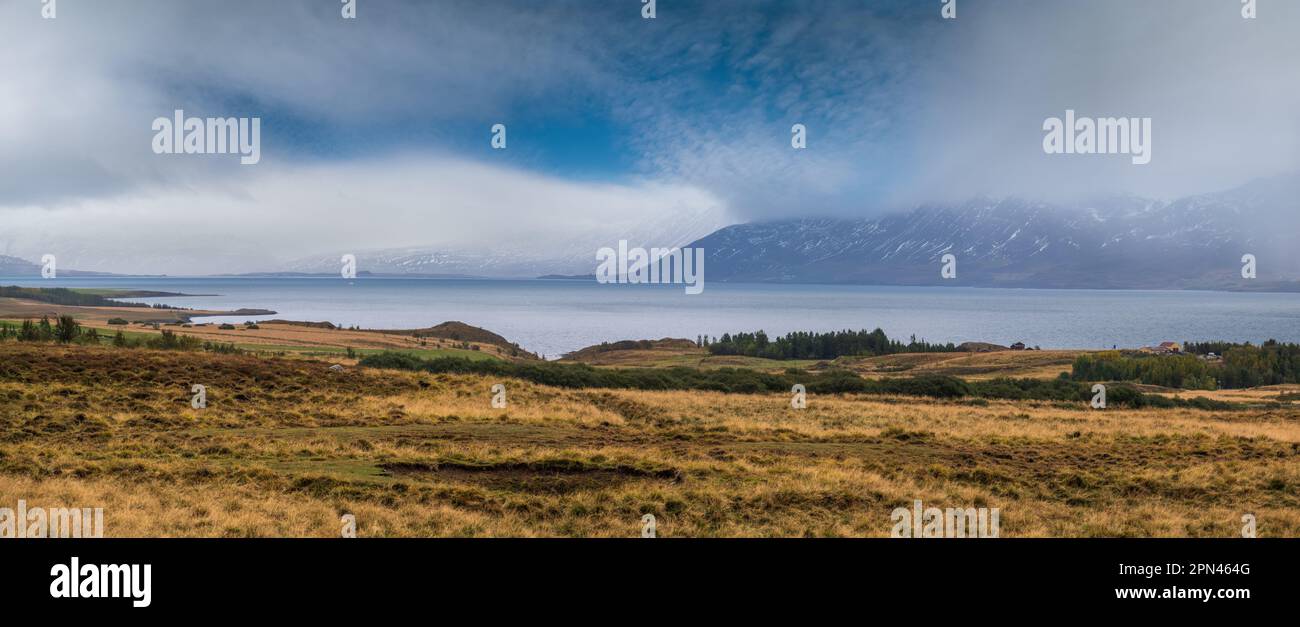 View during auto trip in Iceland. Spectacular Icelandic landscape with  scenic nature: mountains, fjords, fields, clouds, glaciers, waterfalls. Stock Photo