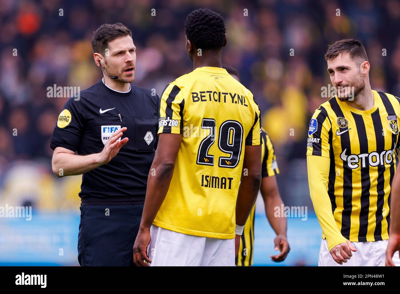 16-04-2023: Sport: NEC v Vitesse  NIJMEGEN, NETHERLANDS - APRIL 16: referee Jochem Kamphuis and Nicolas Isimat-Mirin (Vitesse Arnhem) during the match Stock Photo