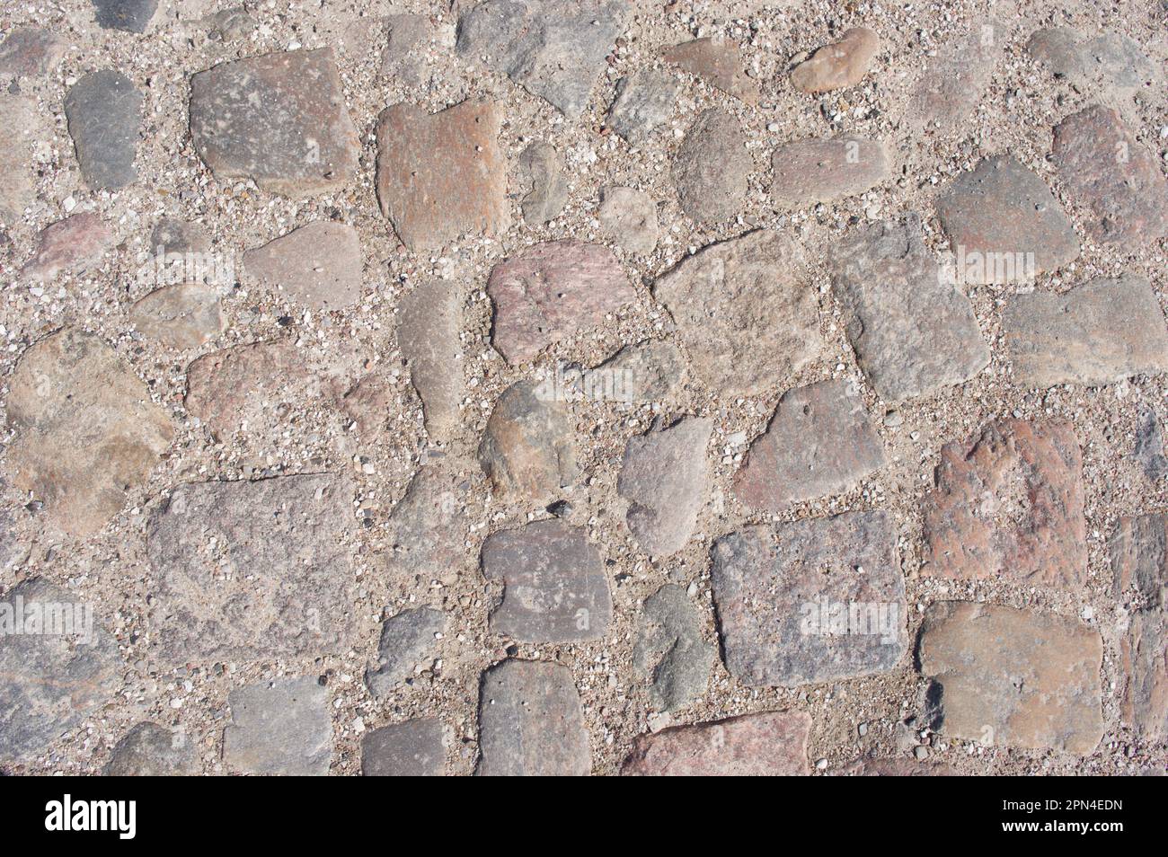 Grey cobblestone with grit street pattern background Stock Photo