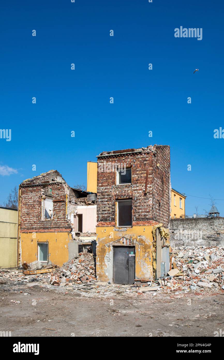 Partly demolished residential building against clear blue sky on the corner of Põhja puiestee and Kotzebue in Kalamaja district of Tallinn, Estonia Stock Photo