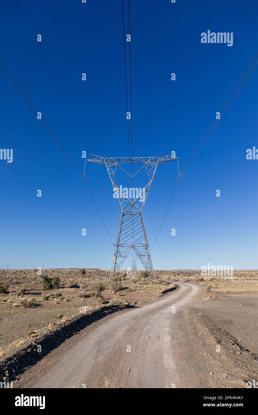 High voltage electricity transmission pylons and lines with a gravel