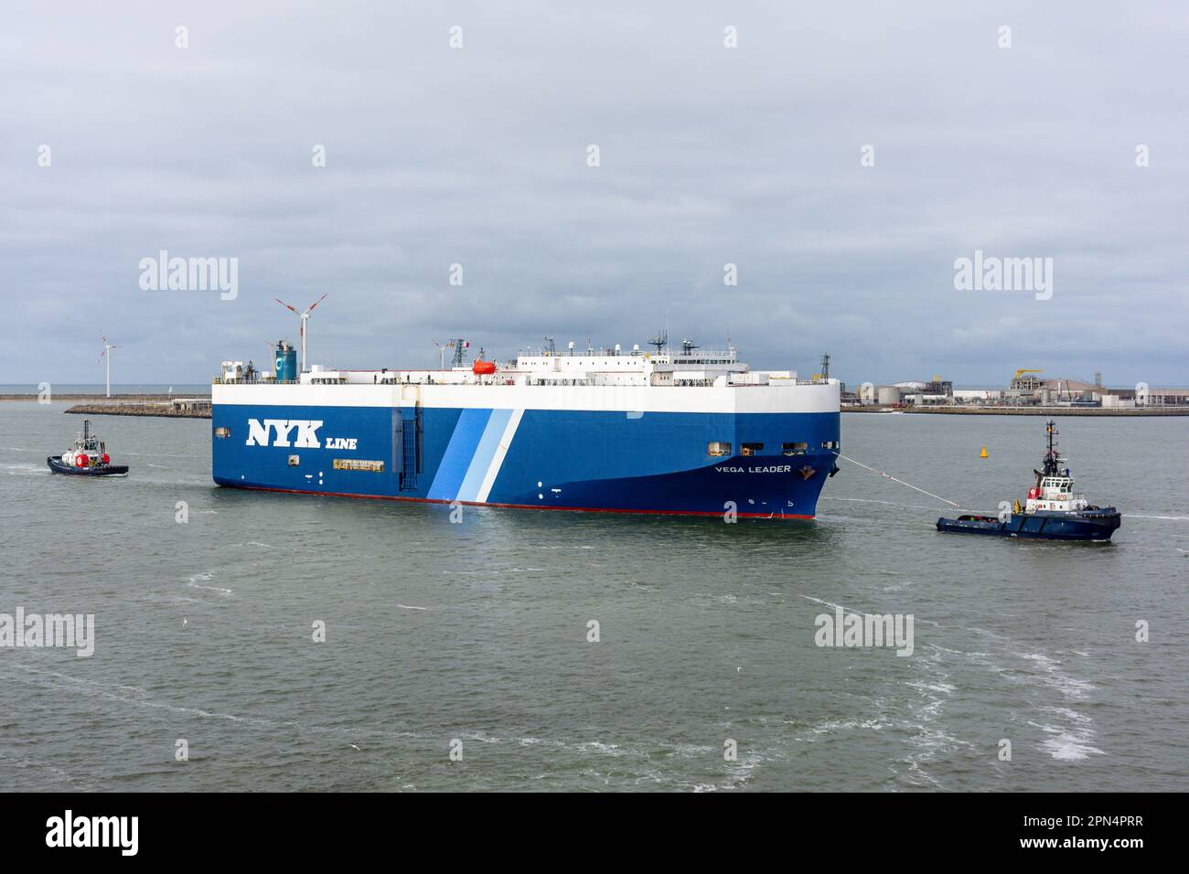 Vega Leader Ro-Ro Cargo Ship being towed in Port of Zeebrugge, Bruges (Brugge), West Flanders Province, Kingdom of Belgium. Stock Photo