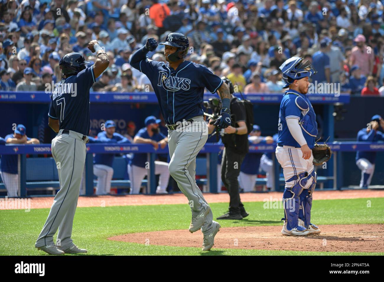 Toronto, Canada. 16th Apr, 2023. Tampa Bay Rays' Christian Bethancourt (14)  and Vidal Brujan (7) celebrate after Bethancourt hit a two run home run  during fifth inning AL MLB baseball action against