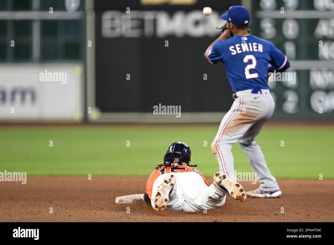 Houston Astros catcher Martin Maldonado (15) dives safely into second for a double in the Botton of the seventh inning during the MLB game between the Stock Photo