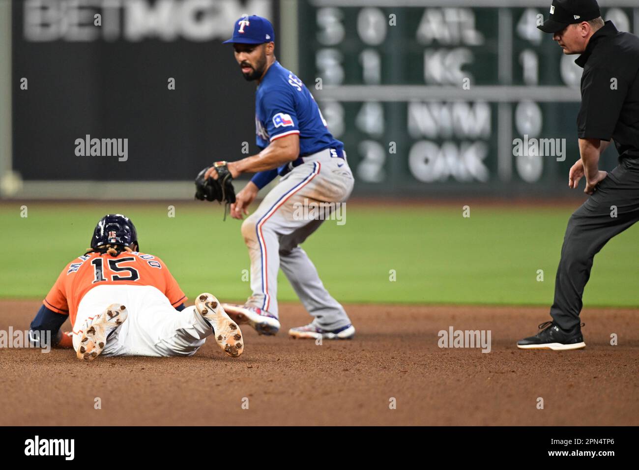 Houston Astros catcher Martin Maldonado (15) dives safely into second for a double in the Botton of the seventh inning during the MLB game between the Stock Photo