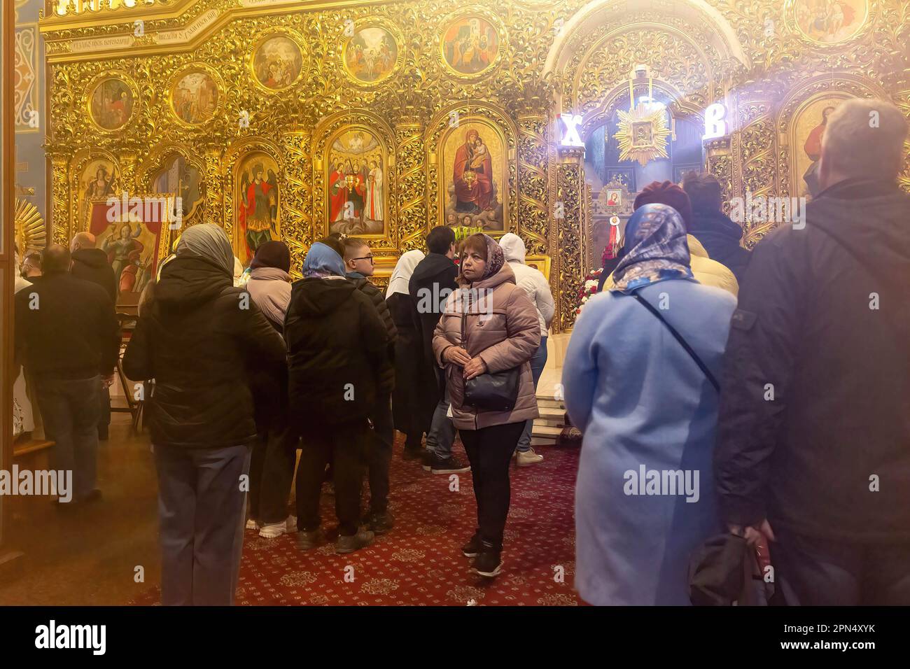 Ukrainian believers seen praying during the Easter Sunday celebrations in St. Michael's Golden-Domed Monastery in central Kyiv. According to the tradition the faithful bring their Easter food in a basket to be purified, it is always Pasha (Easter bread), painted egg (pysanka) among other. Most of Ukrainians are Orthodox Christians or Greek Catholic Christians, both observe the eastern rite of Easter. Kyiv remains relatively peaceful as the Russian invasion continuous and Ukraine prepares for a spring counter-offensive to retake Ukrainian land occupied by Russia. Stock Photo