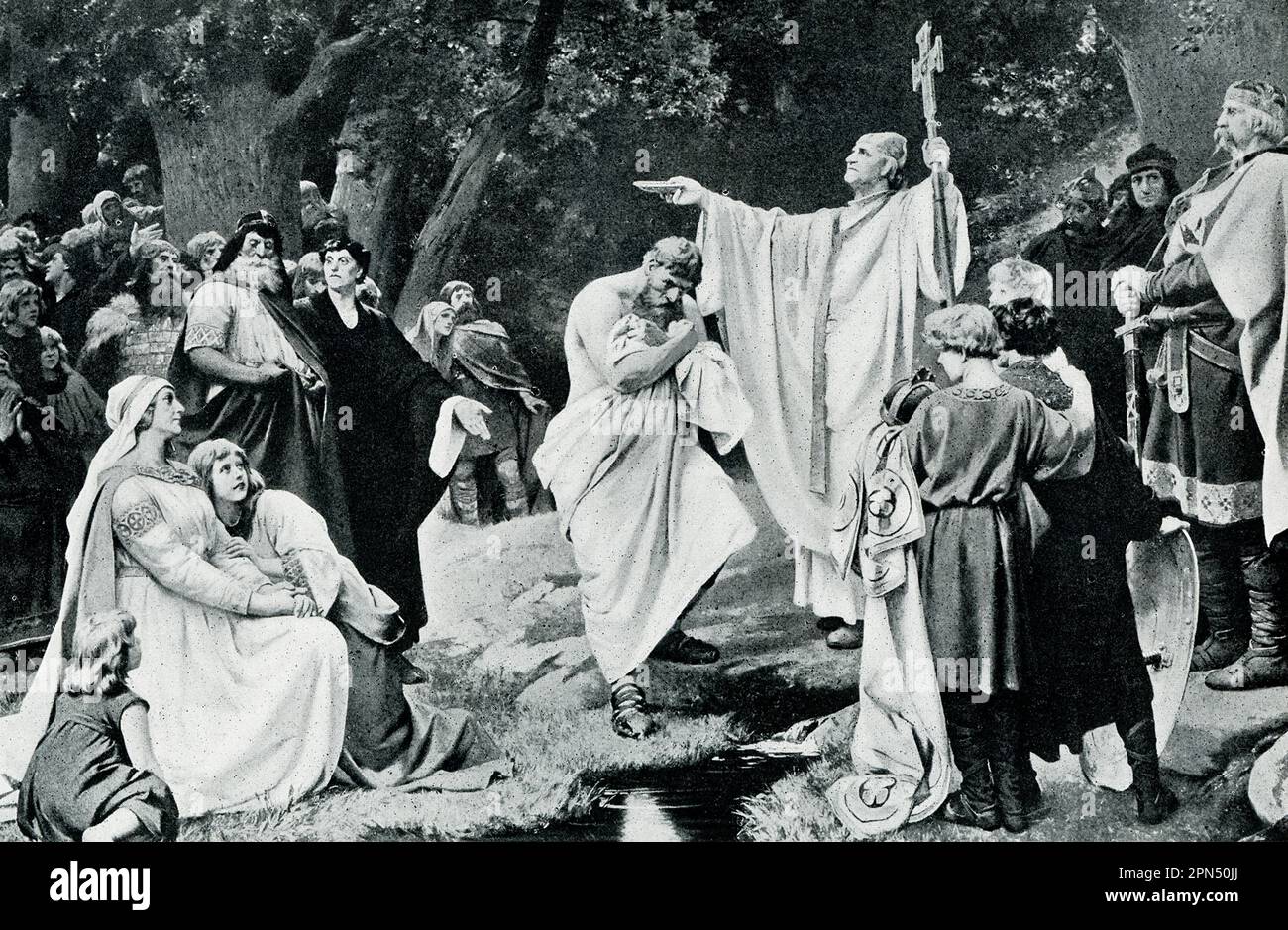 The 1906 caption reads: "Baptism of Wittekind. The Germans in the northeast, that is, the Saxons, were not finally converted to Christianity until Charlemagne’s time. He conquered them and forced his faith upon them. Their most heoric leader was Wittekind, a man scarce inferior to Charlemagne himself either as general or as statesman. Wittekind held out until the Saxon cause was utterly hopeless; then he submitted and accepted baptism [about 785 AD]. Vast crowds of the Saxons followed him to the font; and Charlemagne himself acted as the new convert’s godfather." Stock Photo