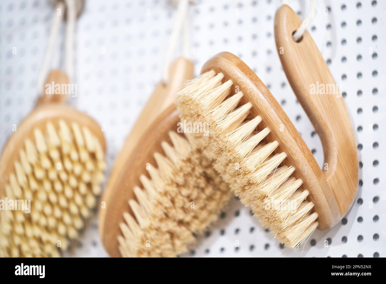 kitchen brushes hang in supermarket Stock Photo