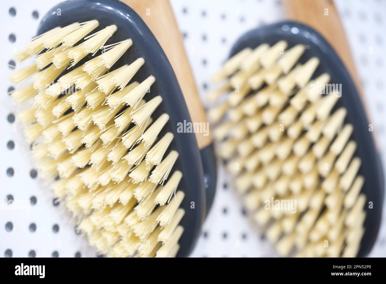 kitchen brushes hang in supermarket Stock Photo