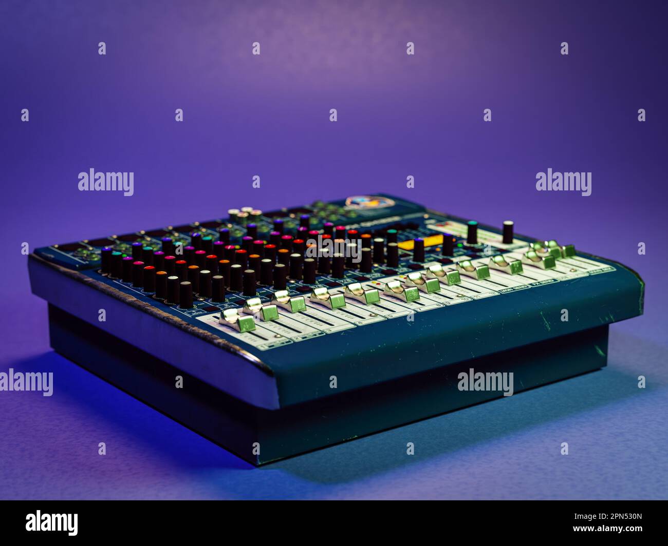 3D rendering of vintage audio mixer over violet background Stock Photo
