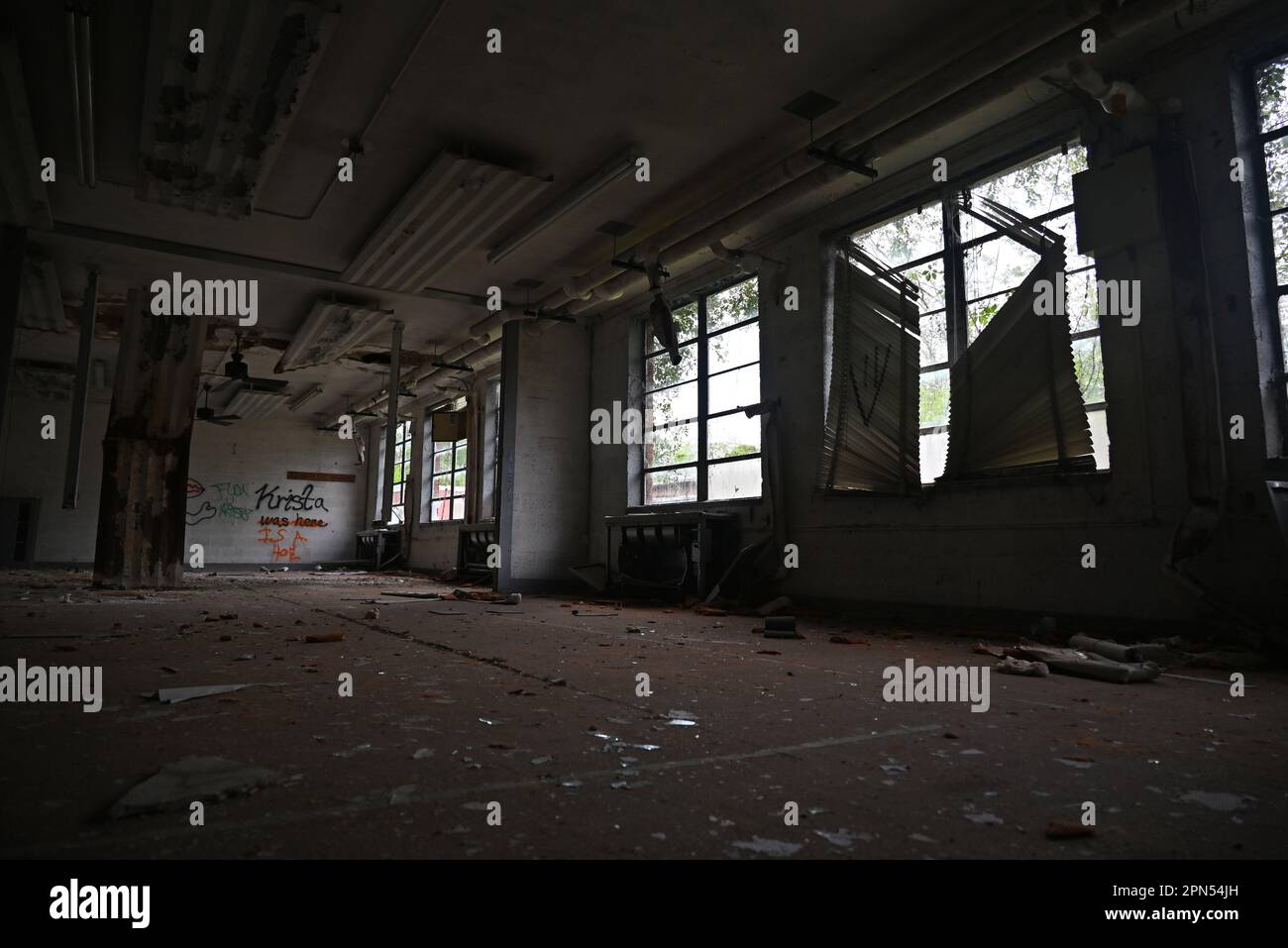 A decaying classroom at a school that has been abandoned since 2001. Stock Photo