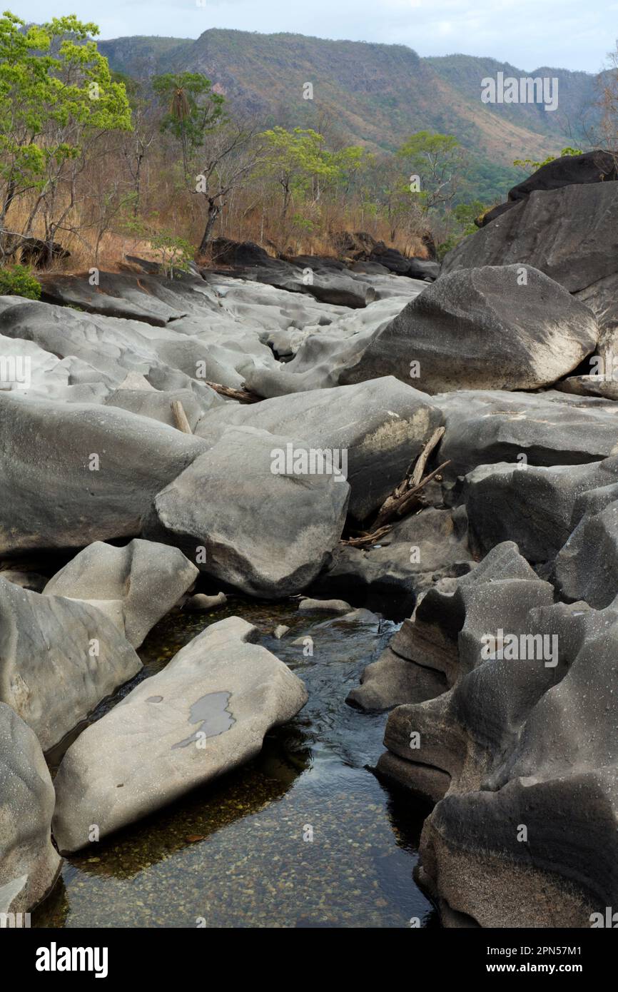 Brazil, Chapada dos Veadeiros, Vale da Lua: Rock outcrop of conglomerates in  São Miguel river bed submitted to fluvial erosion by carbonate dissolution. Stock Photo