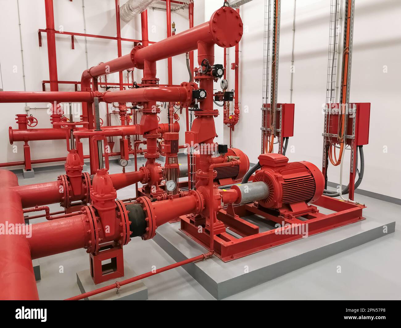 View at industrial electrically powered water pumps and pipes, this