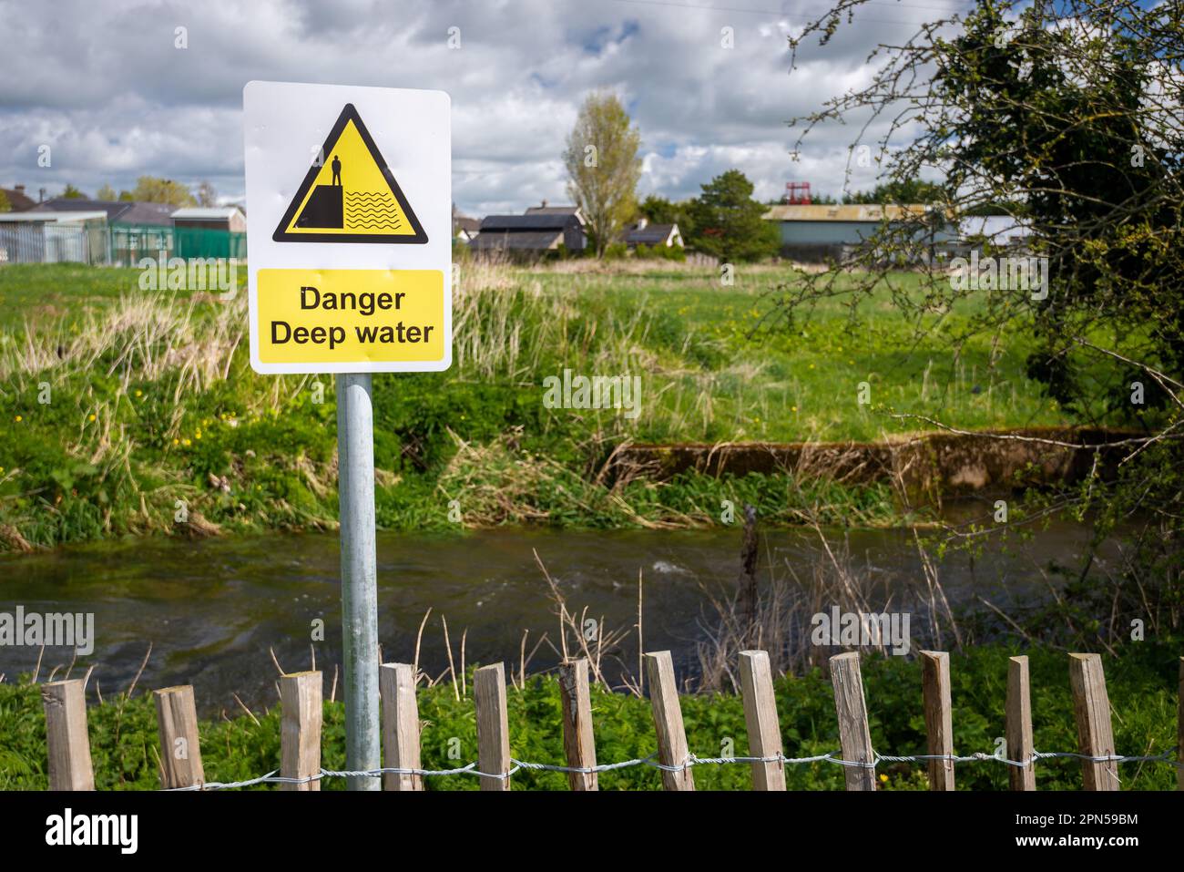 Danger Deep Water warning sign by rural waterway river hazard. Risk of