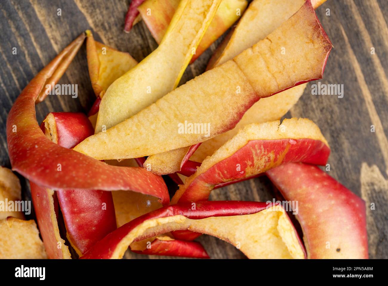 the flaccid peel of a peeled apple on the table, the peel of peeled apples in the trash Stock