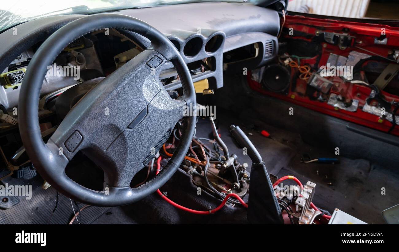 Car interior with disassembled electrics in the garage Stock Photo Alamy