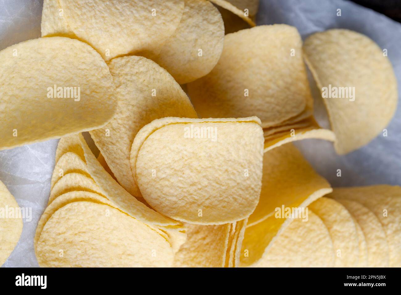 thin potato chips with spices, fried in sunflower oil thin potato chips Stock Photo Alamy