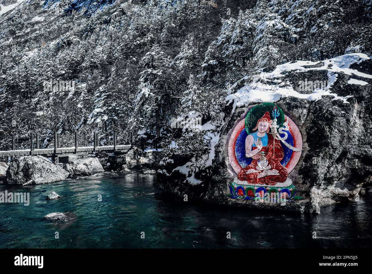 Painted stone carvings of Tibetan Buddha statues in the high mountains ...