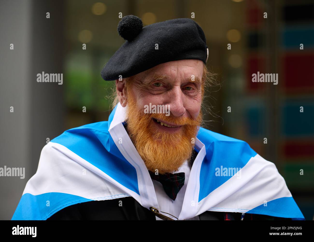 New York, New York, USA. 15th Apr, 2023. Man in Balmoral cap, wrapped in the Scottish flag at the 25th annual New York City Tartan Day Parade celebrating Scottish culture. (Credit Image: © Edna Leshowitz/ZUMA Press Wire) EDITORIAL USAGE ONLY! Not for Commercial USAGE! Credit: ZUMA Press, Inc./Alamy Live News Stock Photo