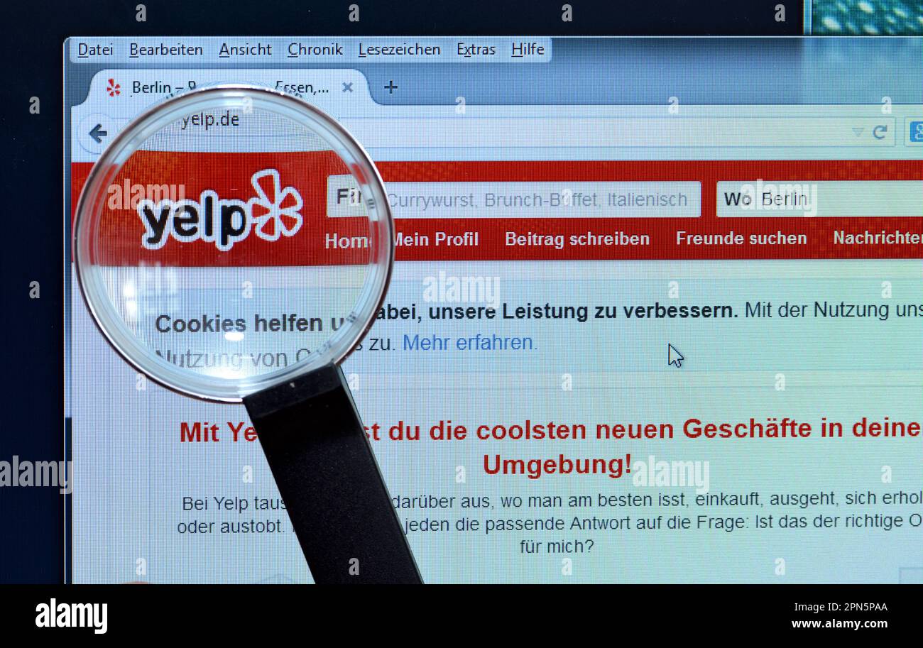 Screen, internet, magnifying glass, comparison portal, yelp.de Stock Photo