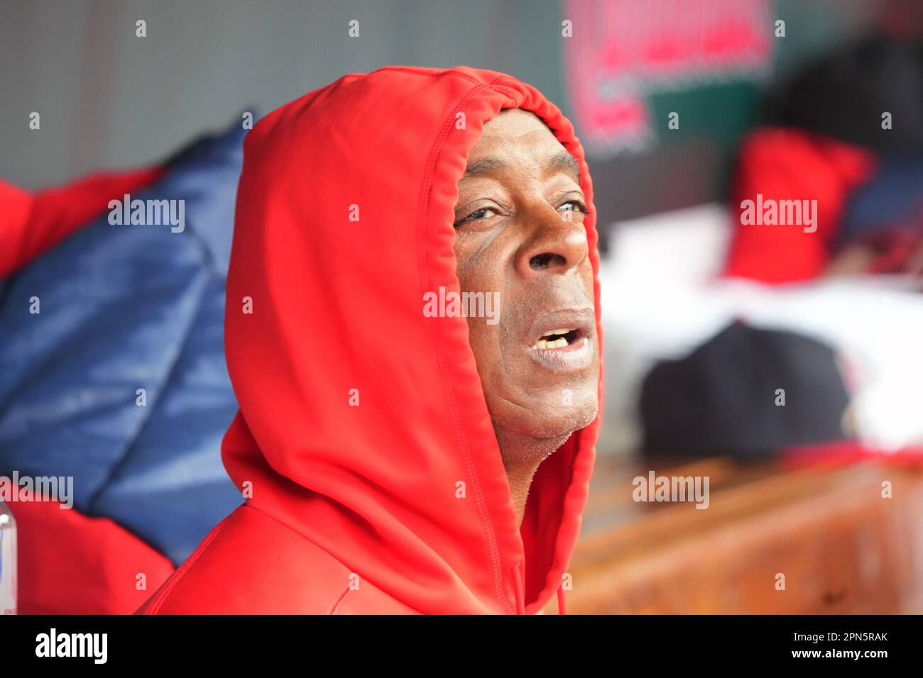 St. Louis, United States. 16th Apr, 2023. St. Louis Cardinals coach Willie McGee, tries to keep warm in the dugout during a game against the Pittsburgh Pirates at Busch Stadium in St. Louis on Sunday, April 16, 2023. Temperatures only reached 47 degrees on the day. Photo by Bill Greenblatt/UPI Credit: UPI/Alamy Live News Stock Photo