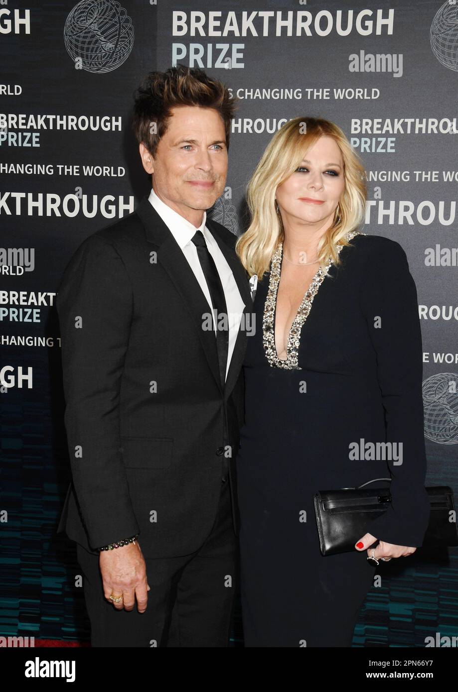 LOS ANGELES, CALIFORNIA - APRIL 15: (L-R) Rob Lowe and Sheryl Berkoff attend the Ninth Breakthrough Prize Ceremony at Academy Museum of Motion Picture Stock Photo