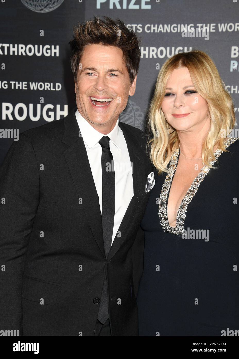 LOS ANGELES, CALIFORNIA - APRIL 15: (L-R) Rob Lowe and Sheryl Berkoff attend the Ninth Breakthrough Prize Ceremony at Academy Museum of Motion Picture Stock Photo