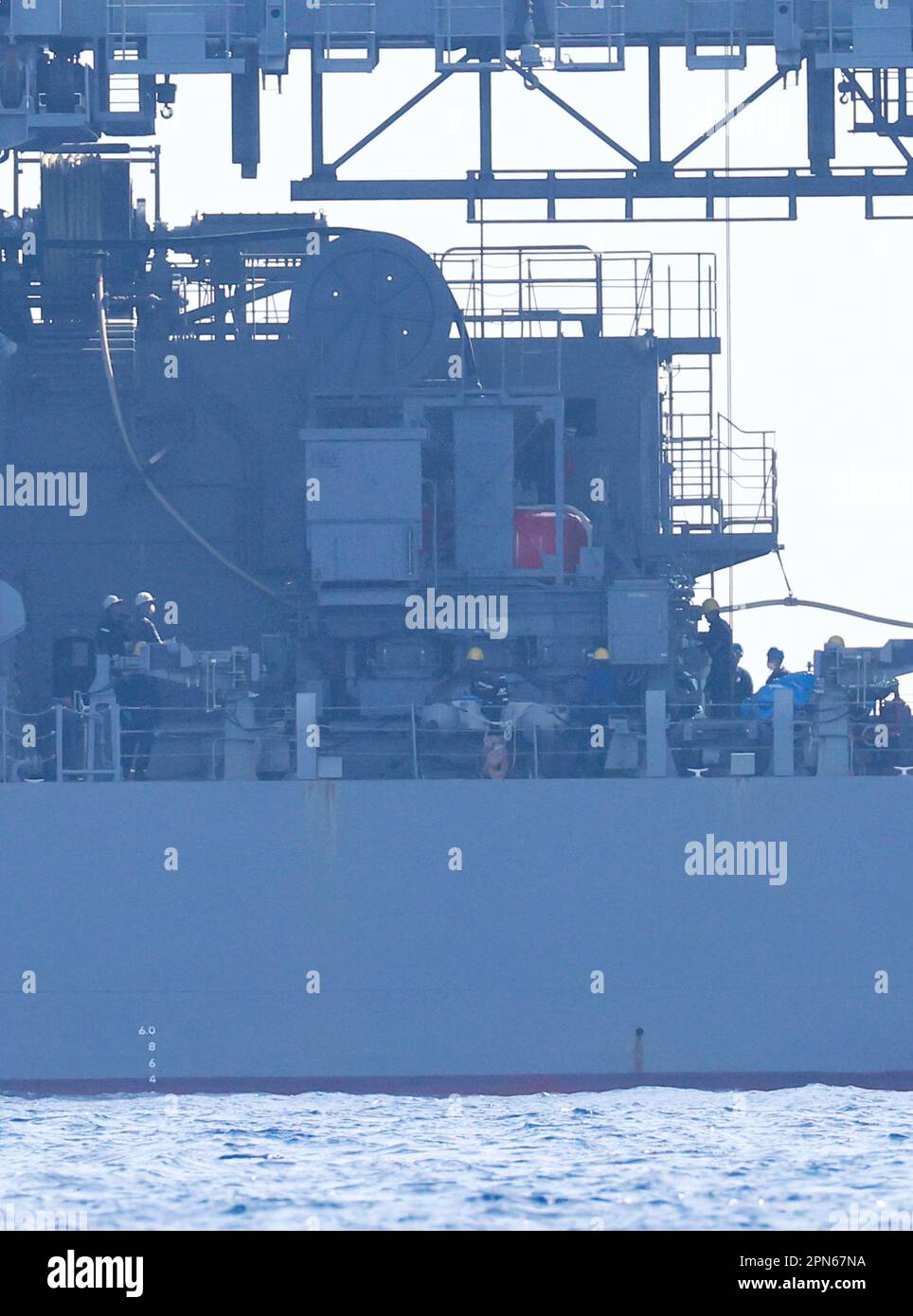 Crew members of the Chihaya, a submarine rescue ship of the Japan ...