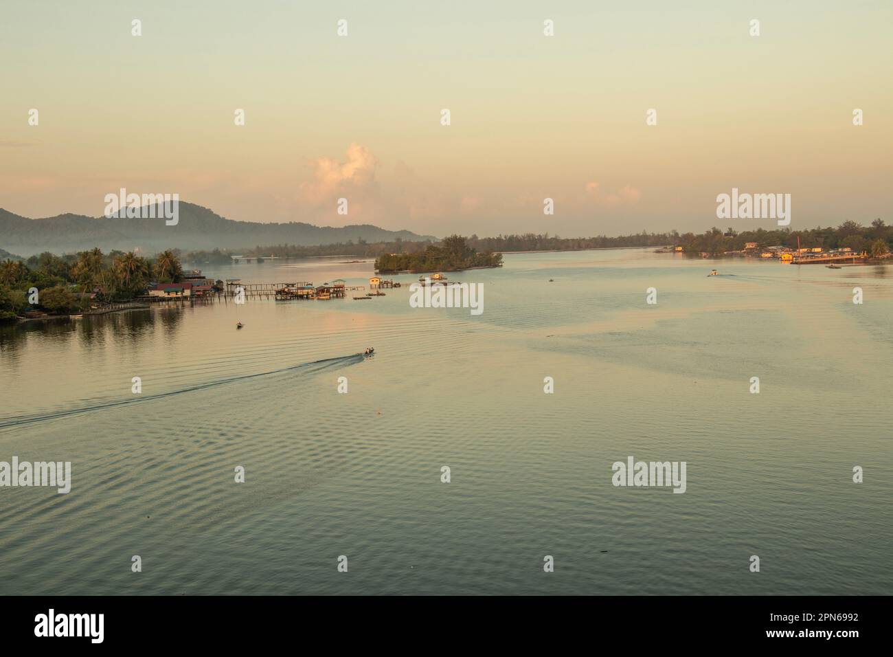 Engineering project over Mengkabong river while fishing boats continue