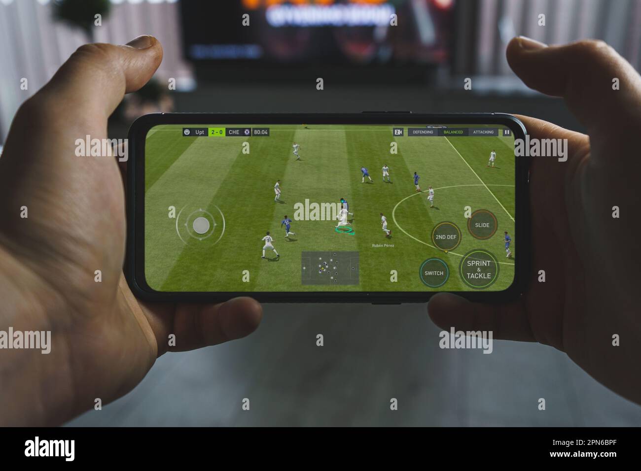 Playing FIFA mobile game. Point of view gaming football game on smartphone  Stock Photo - Alamy