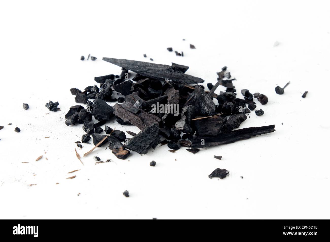 Black charcoal particles isolated on a white background, Activated