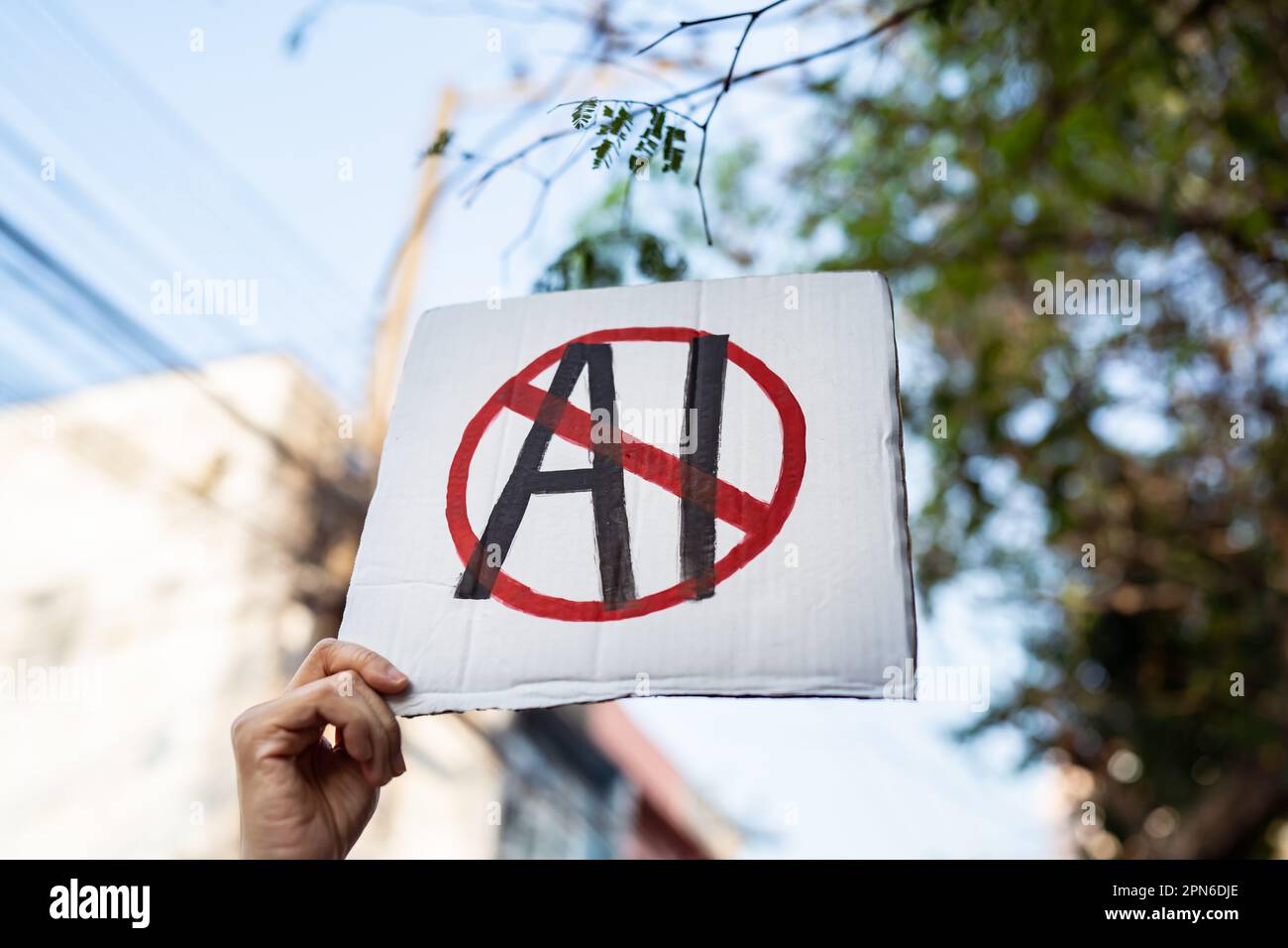 Demonstrator holding "No AI" placard Stock Photo