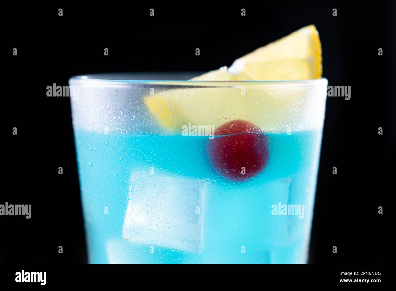 Deep blue sea martini cocktail on wooden table Stock Photo - Alamy