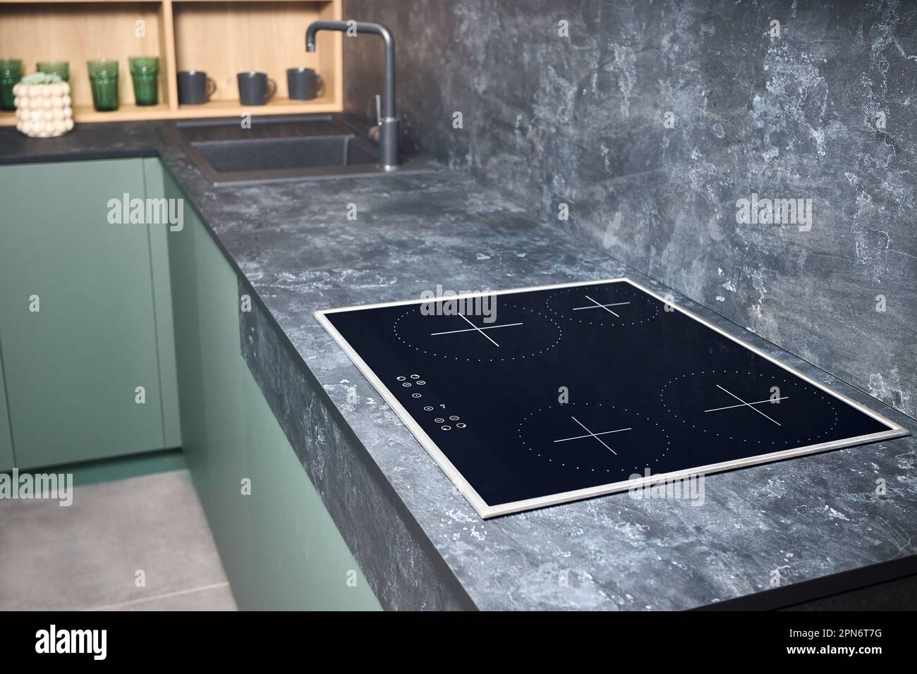 Upscale modern flat design loft kitchen with Induction electric cooker