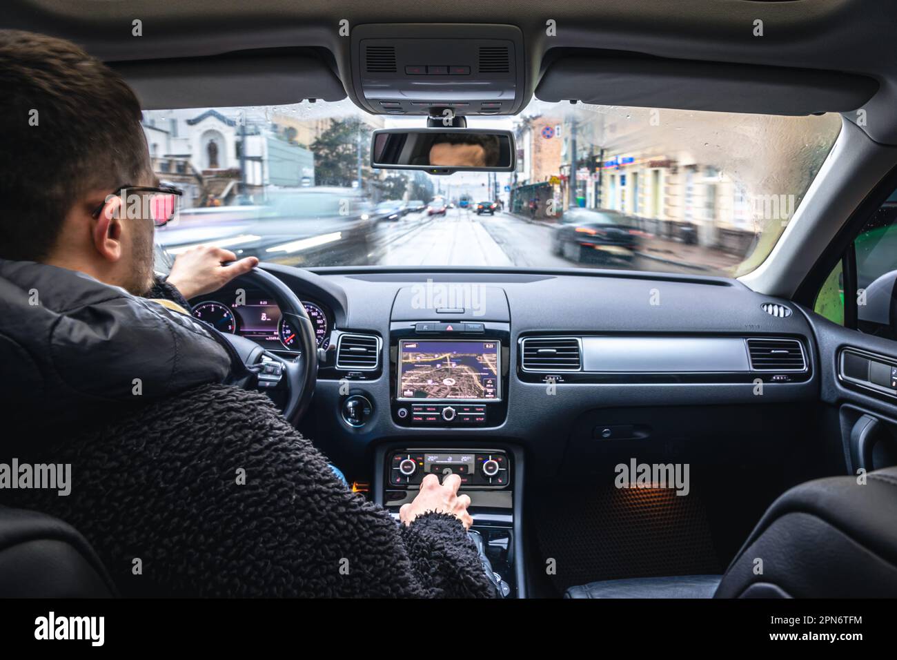 Hands on the wheel when driving at high speed from inside the car Stock